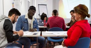 immigrant students studying in classroom