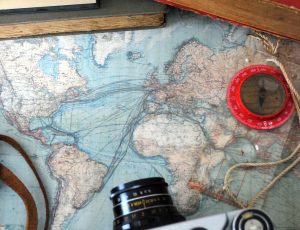 "Map, camera and compass"
